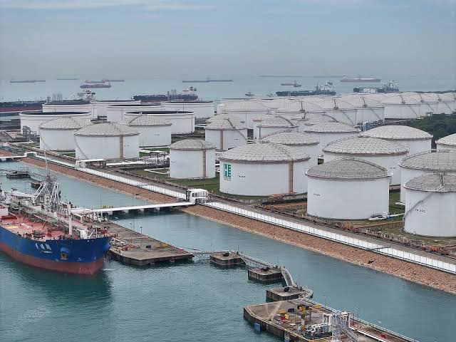 Tanker berthed at the terminal jetty next to the tank farm